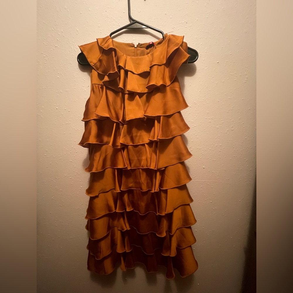 Ruffled, silky rust color dress. Size small. Never worn. NWT. Make an offer.